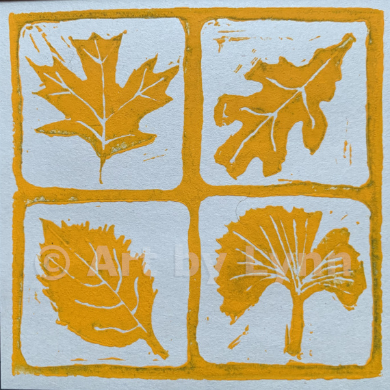 Relief print of four leaves.