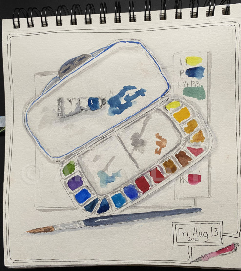 Watercolor and ink of a painter’s art palette tray with paint colors in it.
